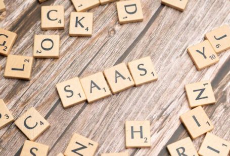 SaaS - Scrabble letters spelling saas on a wooden table