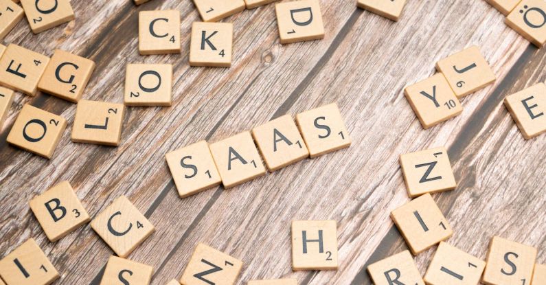 SaaS - Scrabble letters spelling saas on a wooden table