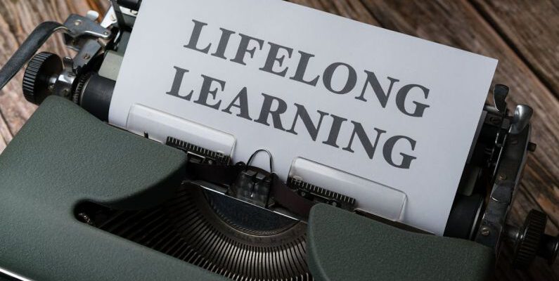 Lifelong Learning - A typewriter with the word long life learning on it