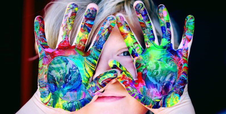 Kids - A KId With Multicolored Hand Paint