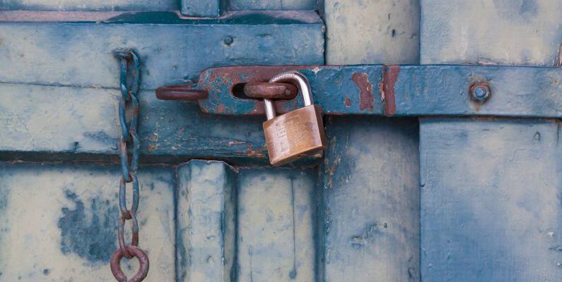 Privacy - Gold Padlock Locking Door